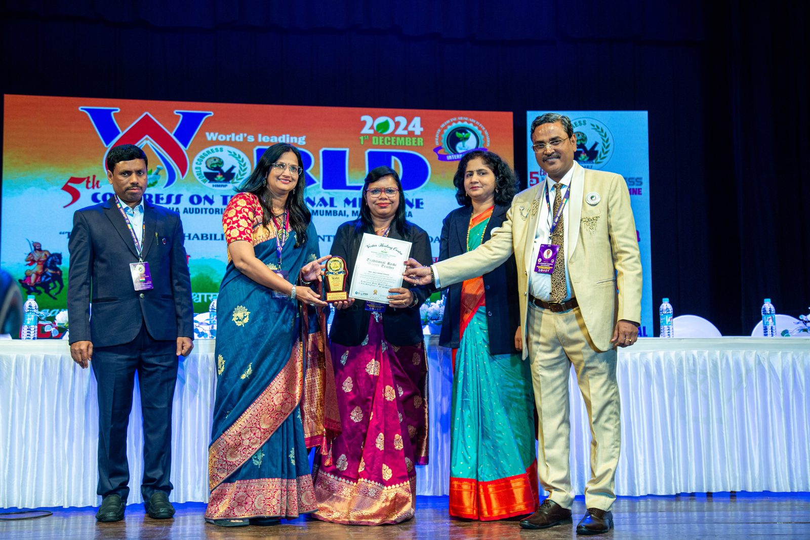 Anju Pahade honoured on stage at an awards ceremony
